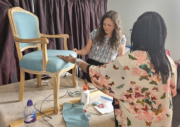 Students welcome professional upholsterer to their pop up workshop