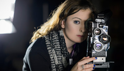 Student using a film camera